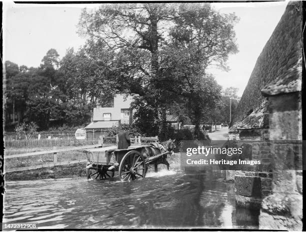 Mill Bridge, Frensham Road, Frensham, Waverley, Surrey, 1909. A horse-drawn cart leaving the River Wey beside Mill Bridge. In the negative index for...