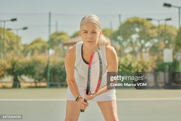 fitness, sports portrait or woman on tennis court in game or practice match in retirement in summer for wellness. healthy senior athlete ready for playing with racket in training, workout or exercise - playing tennis stock pictures, royalty-free photos & images