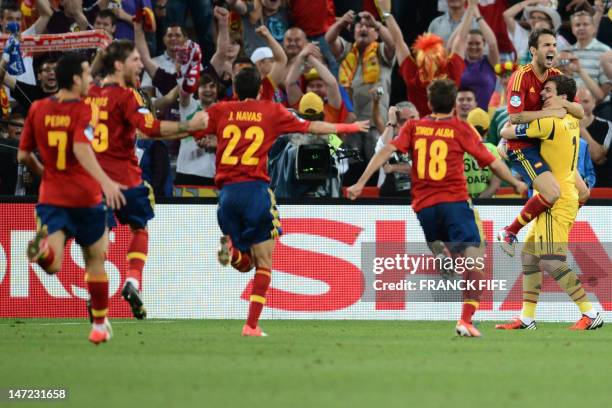 Spanish players celebrate at the end of the penalty shoot out of the Euro 2012 football championships semi-final match Portugal vs. Spain on June 27,...