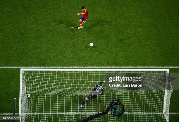 Cesc Fabregas of Spain scores the winning penalty during the UEFA EURO 2012 semi final match between Portugal and Spain at Donbass Arena on June 27,...
