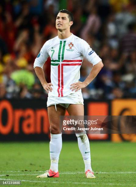 Cristiano Ronaldo of Portugal looks dejected after losing a penalty shoot out during the UEFA EURO 2012 semi final match between Portugal and Spain...