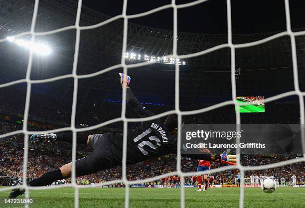 Cesc Fabregas of Spain scores the winning penalty past Rui Patrício of Portugal during the UEFA EURO 2012 semi final match between Portugal and Spain...