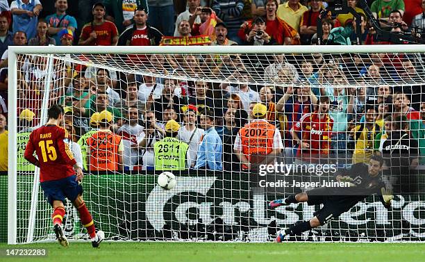 Sergio Ramos of Spain scores a penalty during the UEFA EURO 2012 semi final match between Portugal and Spain at Donbass Arena on June 27, 2012 in...