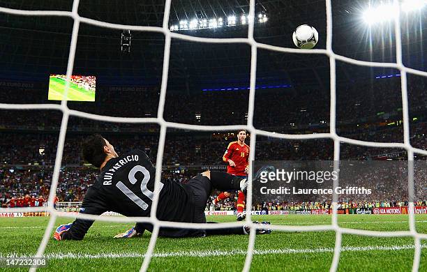 Sergio Ramos of Spain scores a penalty during the UEFA EURO 2012 semi final match between Portugal and Spain at Donbass Arena on June 27, 2012 in...