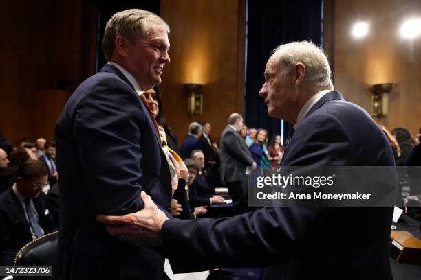 Committee Chairman U.S. Sen. Tom Carper talks to Alan Shaw, President and CEO of Norfolk Southern Corporation, as he arrives to testify before the...