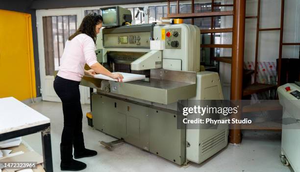 mature woman working in a cutting press - computer printing stock pictures, royalty-free photos & images