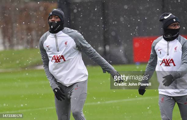 Ibrahima Konate and Naby Keita of Liverpool during a training session at AXA Training Centre on March 09, 2023 in Kirkby, England.