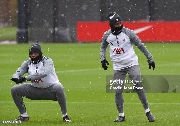 Ibrahima Konate and Naby Keita of Liverpool during a training session at AXA Training Centre on March 09, 2023 in Kirkby, England.