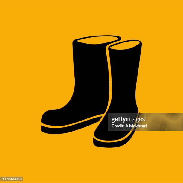boot icon on the orange background. - wellington stock illustrations