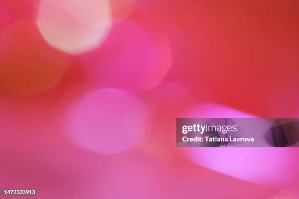 abstract purple red and pink background made by beauty products in soft focus. bright backdrop for design projects - roze achtergrond stockfoto's en -beelden