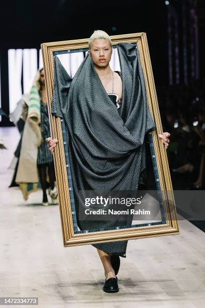 Model showcases designs by Kritikon Khamsawat during the National Graduate Showcase at Melbourne Fashion Festival on March 09, 2023 in Melbourne,...