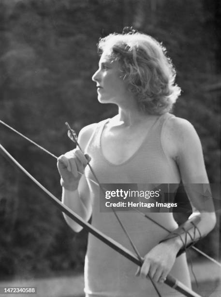 Chase, Diana, Miss, doing archery, 1933 June 22. Creator: Arnold Genthe.