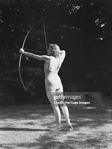 Chase, Diana, Miss, doing archery, 1933 June 22. Creator: Arnold Genthe.