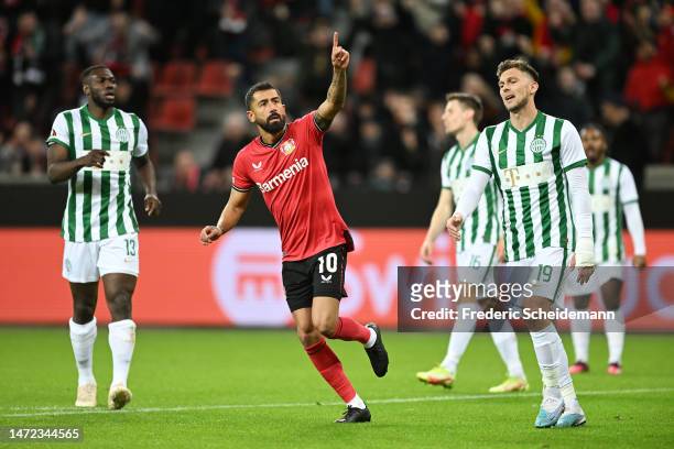 Kerem Demirbay of Bayer 04 Leverkusen celebrates after scoring the team's first goal during the UEFA Europa League round of 16 leg one match between...