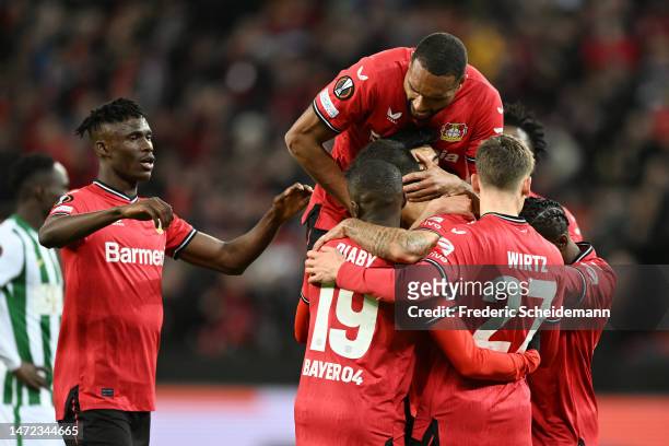 Kerem Demirbay of Bayer 04 Leverkusen celebrates with teammates after scoring the team's first goal during the UEFA Europa League round of 16 leg one...