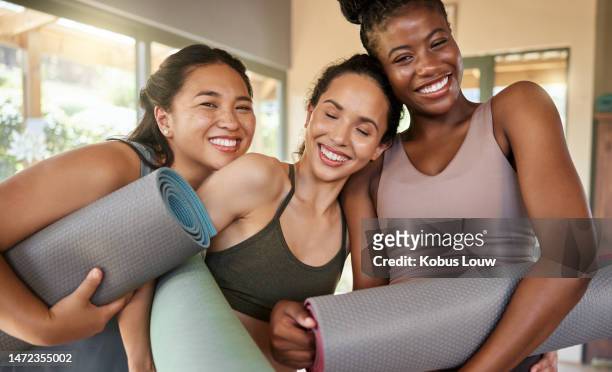 portrait, yoga and women friends in gym after stretching for health, wellness and flexibility. zen, mat and group of happy girls ready to start meditation, pilates or workout, exercise or training. - girl yoga stock pictures, royalty-free photos & images
