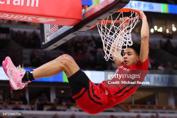 Derek Simpson of the Rutgers Scarlet Knights dunks against the Michigan Wolverines in the second half of the second round of the Big Ten Tournament...
