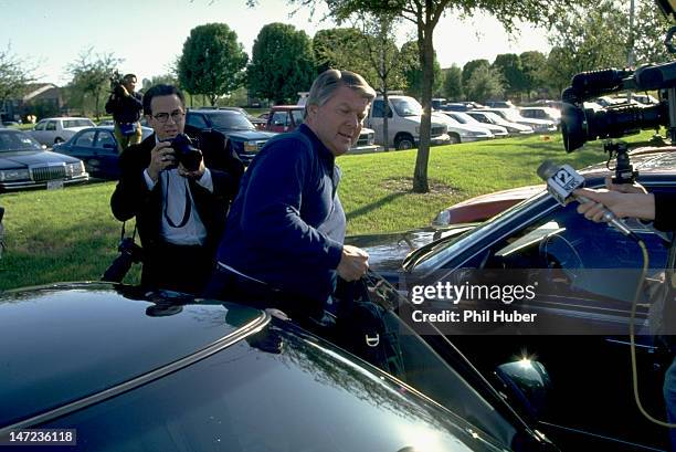 Dallas Cowboys head coach Jimmy Johnson surrounded by media the day before his resignation at Valley Ranch Facility. Irving, TX 3/28/1994 CREDIT:...