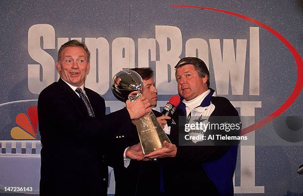 Super Bowl XXVII: Dallas Cowboys owner Jerry Jones victorious with Vince Lombardi Trophy , NBC Sports announcer Bob Costas, and head coach Jimmy...