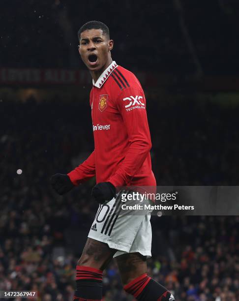 Marcus Rashford of Manchester United celebrates scoring their first goal during the UEFA Europa League round of 16 leg one match between Manchester...