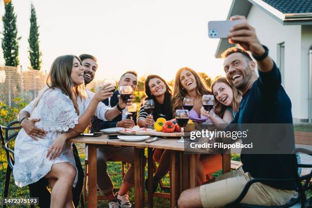 friends are taking a selfie together during a dinner party - personal perspective festival stock pictures, royalty-free photos & images