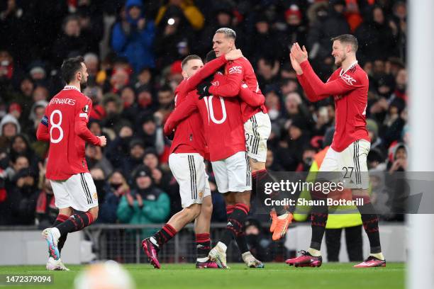 Antony of Manchester United celebrates with teammates after scoring the team's second goal during the UEFA Europa League round of 16 leg one match...