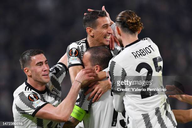 Angel Di Maria of Juventus celebrates with Dusan Vlahovic and teammates after scoring the team's first goal during the UEFA Europa League round of 16...