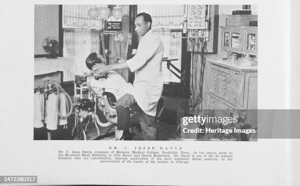 Dr. C. Jesse Davis, graduate of Meharry Medical College, Nashville, Tenn., in his dental suite in the Roosevelt Bank building at 35th Street and...