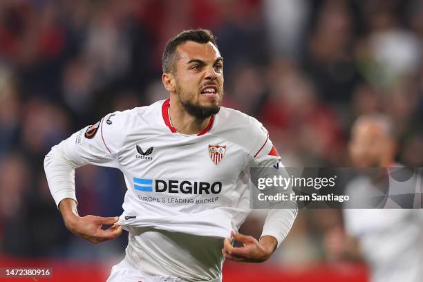 Joan Jordan of Sevilla FC celebrates after scoring the team's first goal during the UEFA Europa League round of 16 leg one match between Sevilla FC...