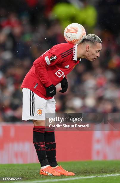 Antony of Manchester United controls the ball on the sideline during the UEFA Europa League round of 16 leg one match between Manchester United and...