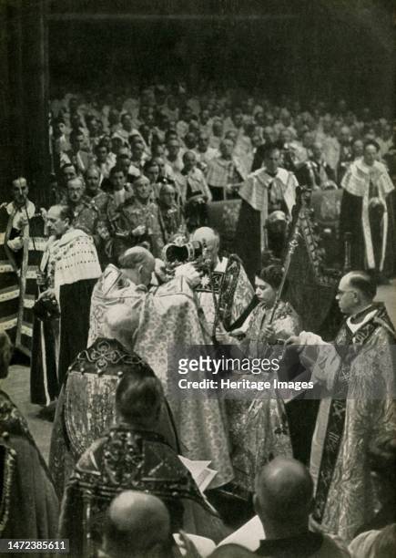 'The Coronation of Her Majesty Queen Elizabeth II, 2nd June, 1953', 1962. The Queen, seated in King Edward's Chair, is crowned by Geoffrey Fisher,...