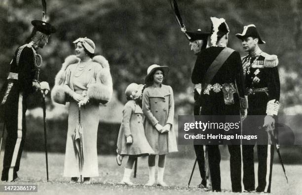 'With the Royal Bodyguard', 1930s, . King George VI and Queen Elizabeth with daughters Princess Elizabeth and Princess Margaret Rose. The king and...