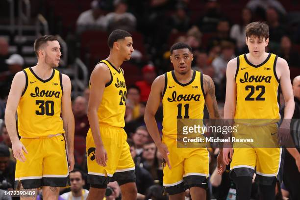 Connor McCaffery, Kris Murray, Tony Perkins and Patrick McCaffery of the Iowa Hawkeyes look on against the Ohio State Buckeyes in the second half of...