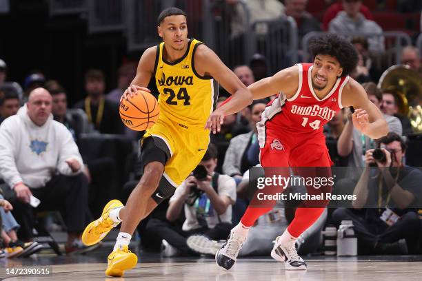 Kris Murray of the Iowa Hawkeyes drives past Justice Sueing of the Ohio State Buckeyes in the second half of the second round in the Big Ten...