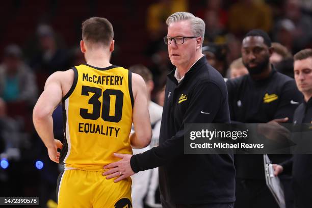 Head coach Fran McCaffery of the Iowa Hawkeyes high fives Connor McCaffery against the Ohio State Buckeyes in the second half of the second round in...