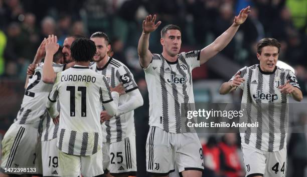 Dusan Vlahovic of Juventus celebrates after his team-mate Angel Di Maria scored during the UEFA Europa League round of 16 leg one match between...