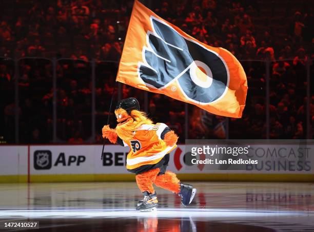 Gritty the mascot of the Philadelphia Flyers skates on the ice prior to the start of an NHL game against the Detroit Red Wings at the Wells Fargo...
