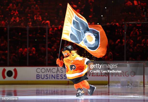 Gritty the mascot of the Philadelphia Flyers skates on the ice prior to the start of an NHL game against the Detroit Red Wings at the Wells Fargo...