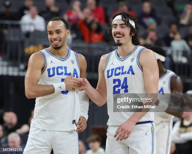 Amari Bailey and Jaime Jaquez Jr. #24 of the UCLA Bruins celebrate on the court late in the second half of a quarterfinal game of the Pac-12...