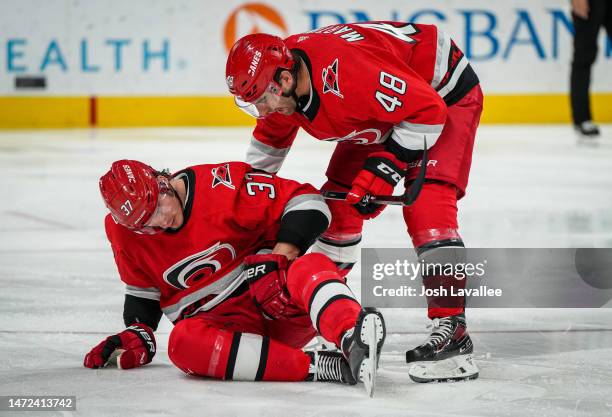 Andrei Svechnikov of the Carolina Hurricanes reacts after suffering an injury during the second period against the Philadelphia Flyers at PNC Arena...