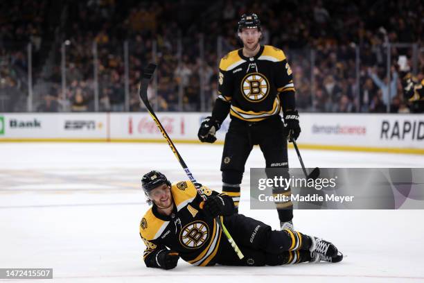 David Pastrnak of the Boston Bruins celebrates with Brandon Carlo after scoring against the Edmonton Oilers during the first period at TD Garden on...