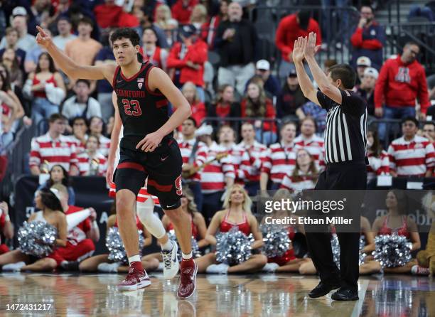 Brandon Angel of the Stanford Cardinal gestures after hitting a 3-pointer against the Arizona Wildcats in the first half of a quarterfinal game of...