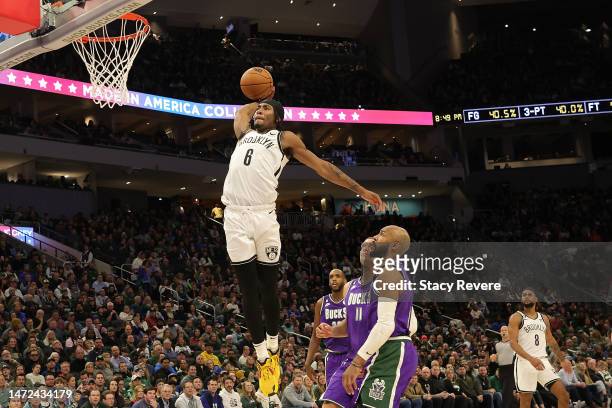 David Duke Jr. #6 of the Brooklyn Nets dunks against the Milwaukee Bucks during the second half of a game at Fiserv Forum on March 09, 2023 in...