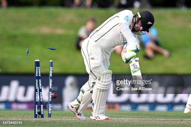 Tom Latham of New Zealand is bowled during day two of the First Test match in the series between New Zealand and Sri Lanka at Hagley Oval on March...