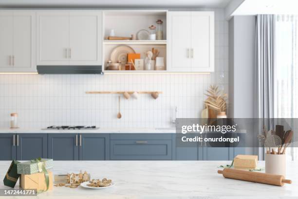 modern kitchen with homemade gingerbread cookies and gift boxes on kitchen counter. baking and selling cookies - cozinha imagens e fotografias de stock