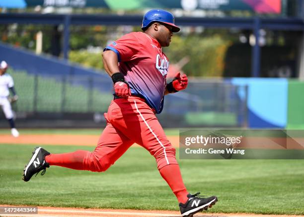 Alfredo Despaigne of Team Cuba hits a RBI double at the bottom of the first inning during the World Baseball Classic Pool A game between Cuba and...