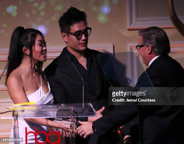Kevin Mazur accepts the Mark Seliger Photography Award from presenters Devon Diep and Kevin Kreider at the 8th Annual Hollywood Beauty Awards...