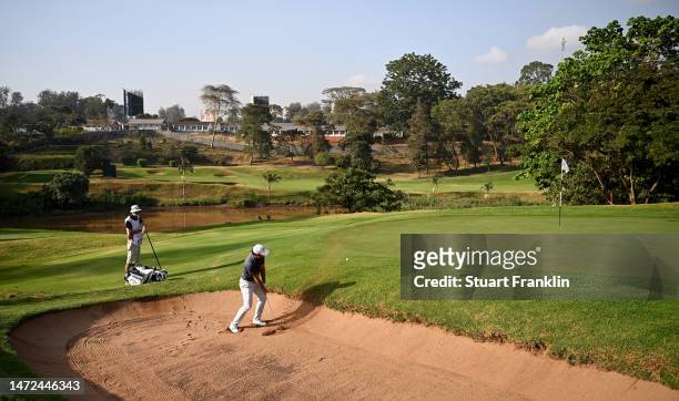 Adrian Otaegui of Spain plays a bunker shot on the second hole during the second round of the Magical Kenya Open Presented by Absa at Muthaiga Golf...