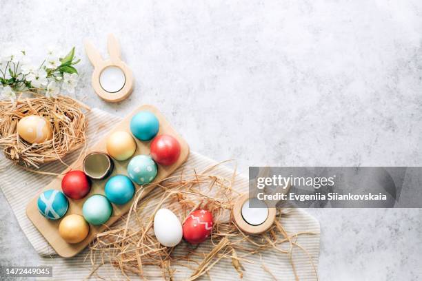 painting easter eggs at home over gray table background. - easter background stock pictures, royalty-free photos & images