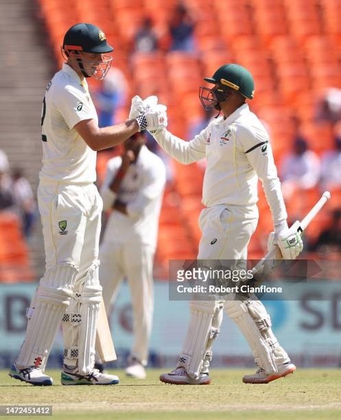 Usman Khawaja of Australia is congratulated by Cameron Green after scoring 150 runs during day two of the Fourth Test match in the series between...